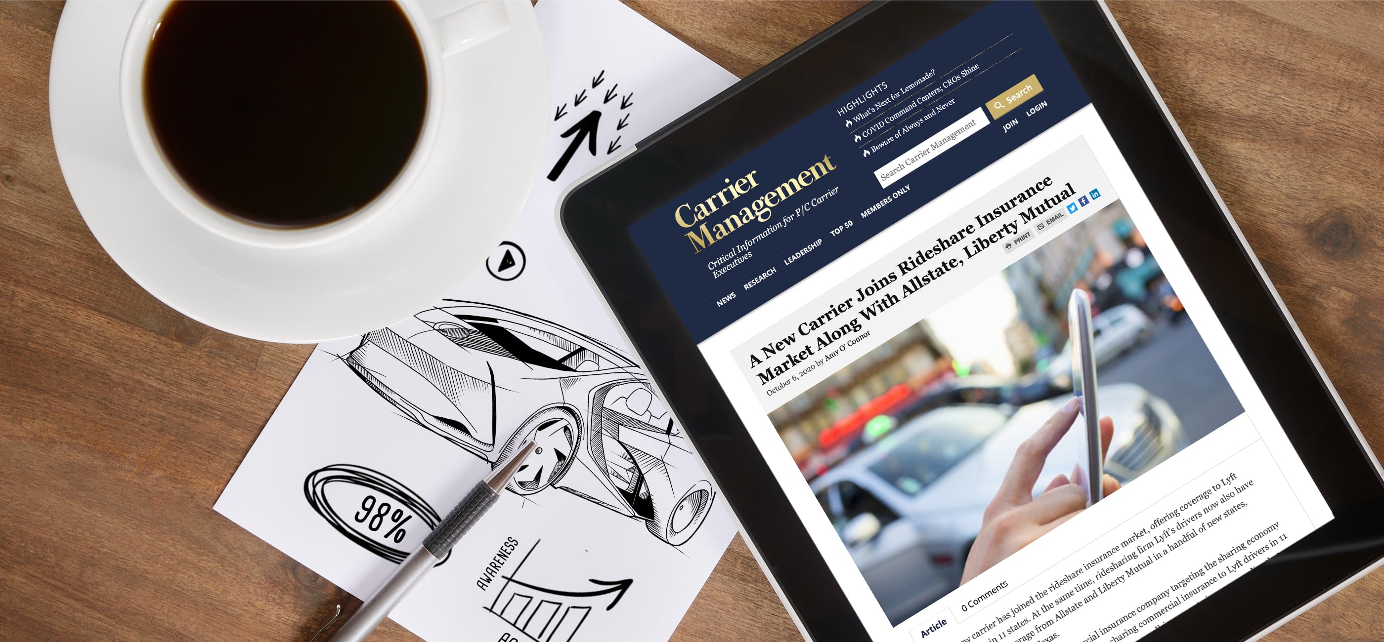 Overhead image of a cup of black coffee, blank white paper with pen, and an electronic tablet with an article about rideshare insurance open