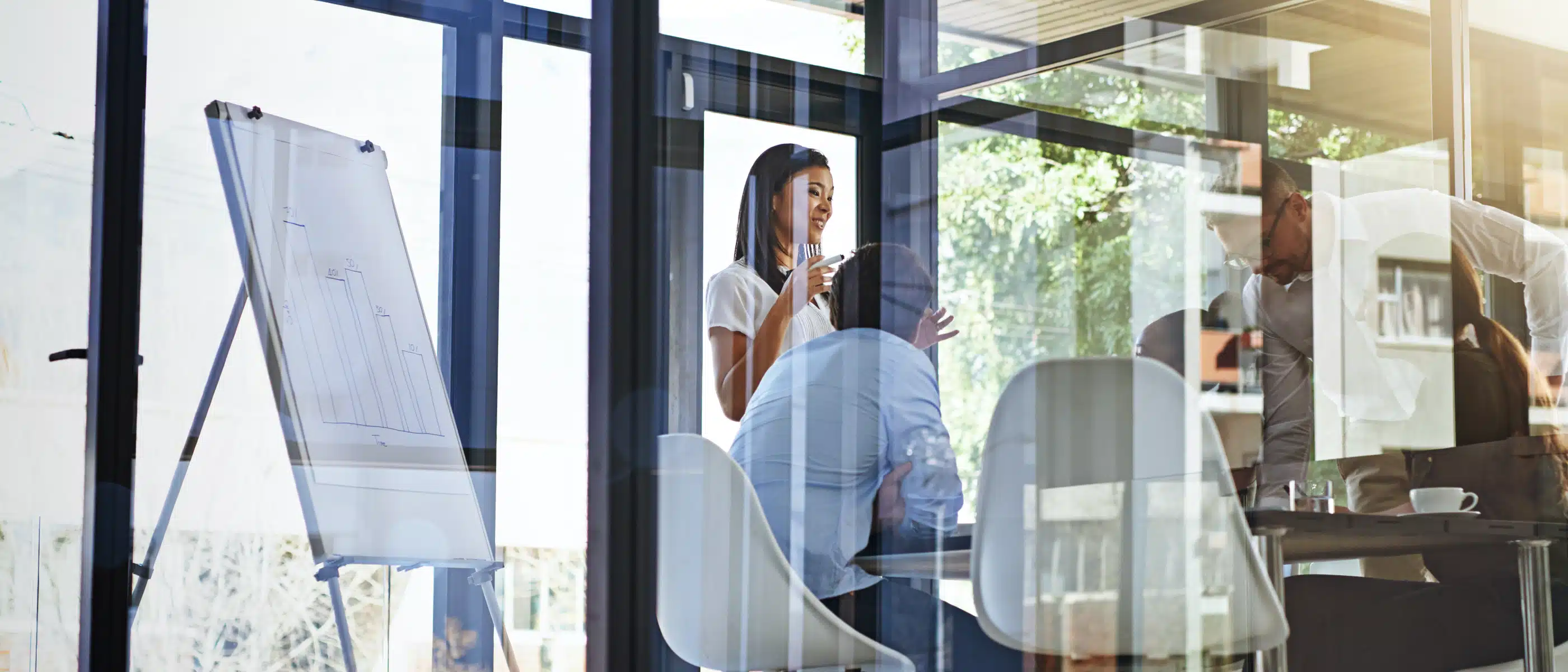 Business Meeting in Glass Office